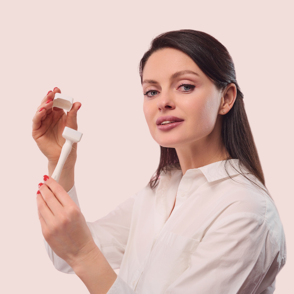 woman holding beautimate skincare tool