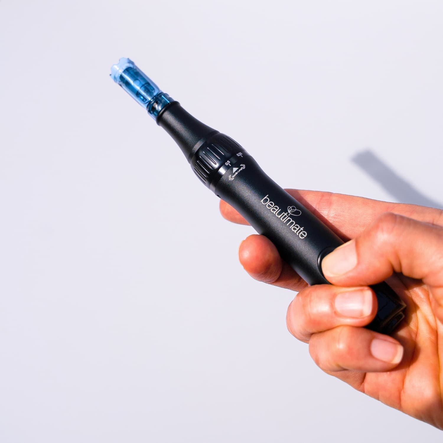 Close-up of the microneedle pen tip and 0.5mm depth dial