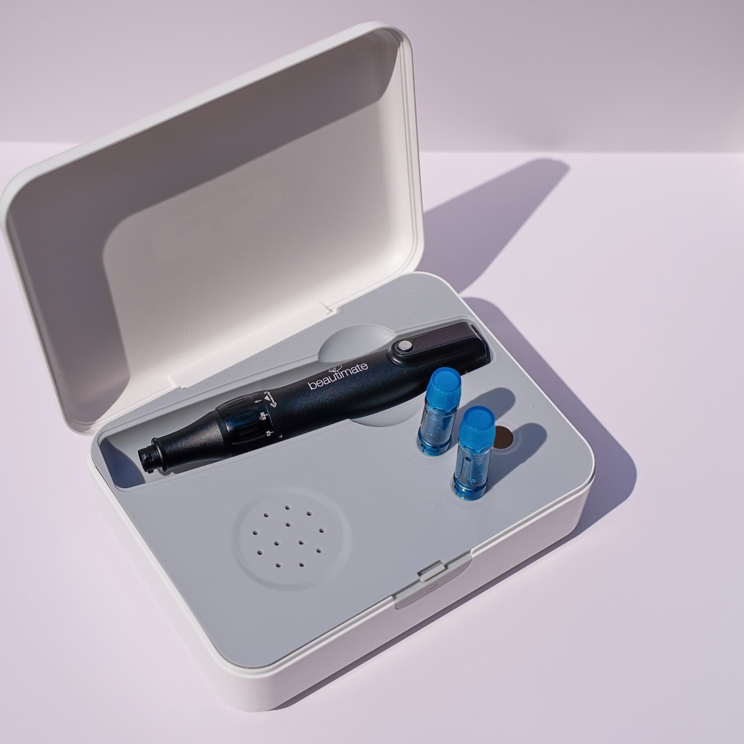 travel case with microneedle pen and cartridges