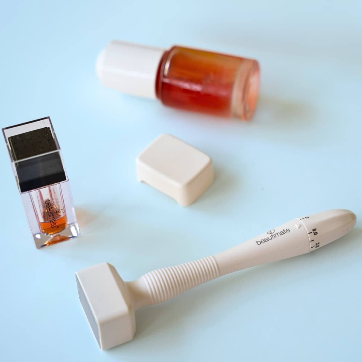 Beautimate Derma Stamp shown before serum application as part of post-treatment skincare