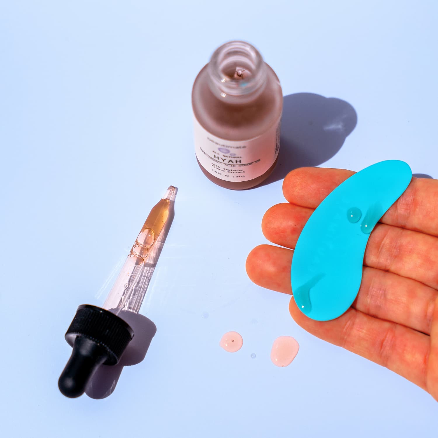 Beautimate reusable eye patches next to hyaluronic acid serum for boosted results