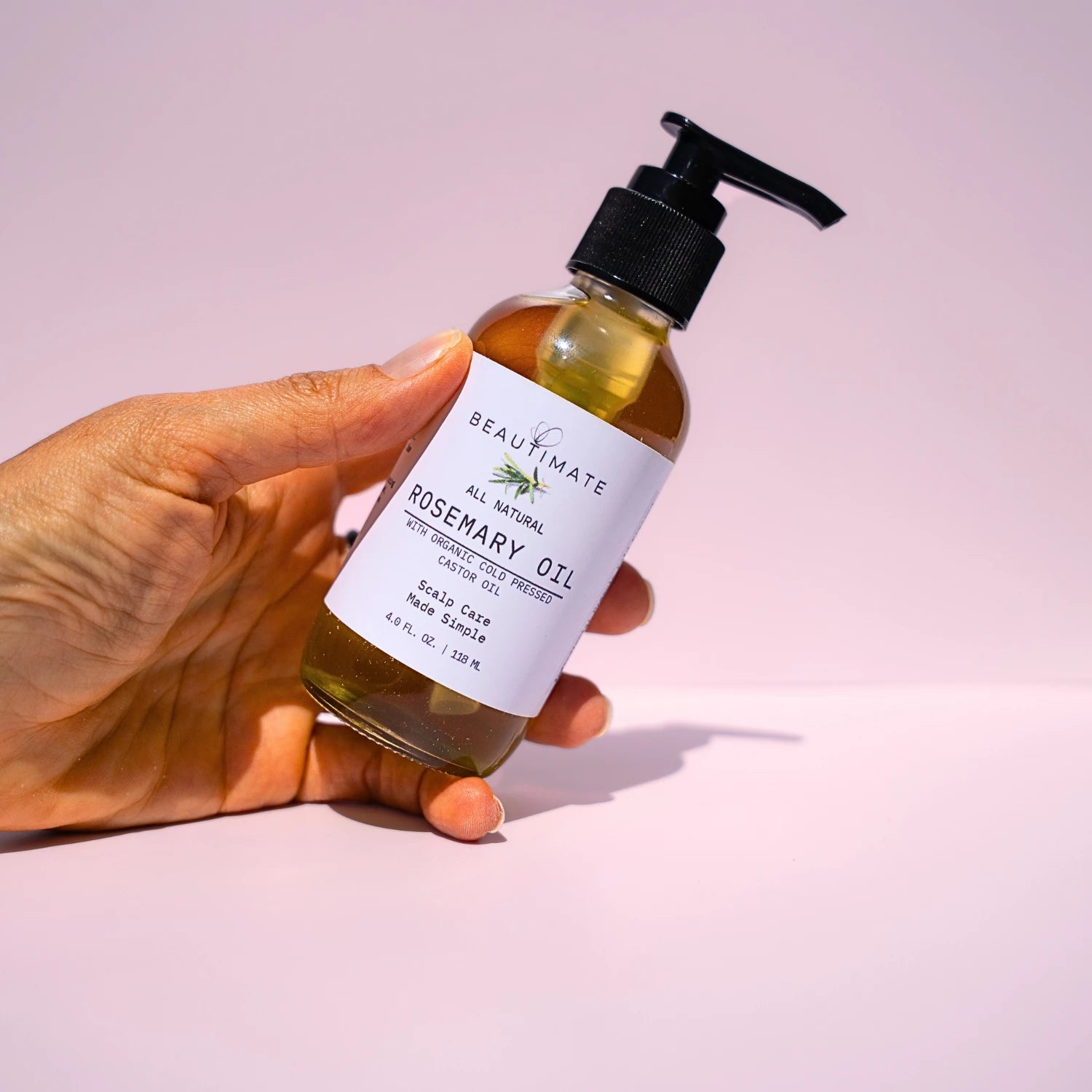 rosemary oil in woman's hand