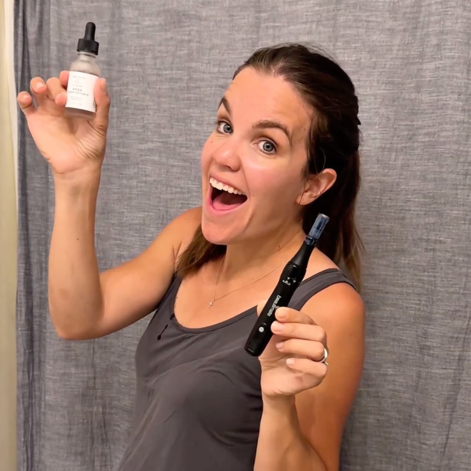 woman holding beautimate microneedle pen and hyah serum - hyaluronic acid serum