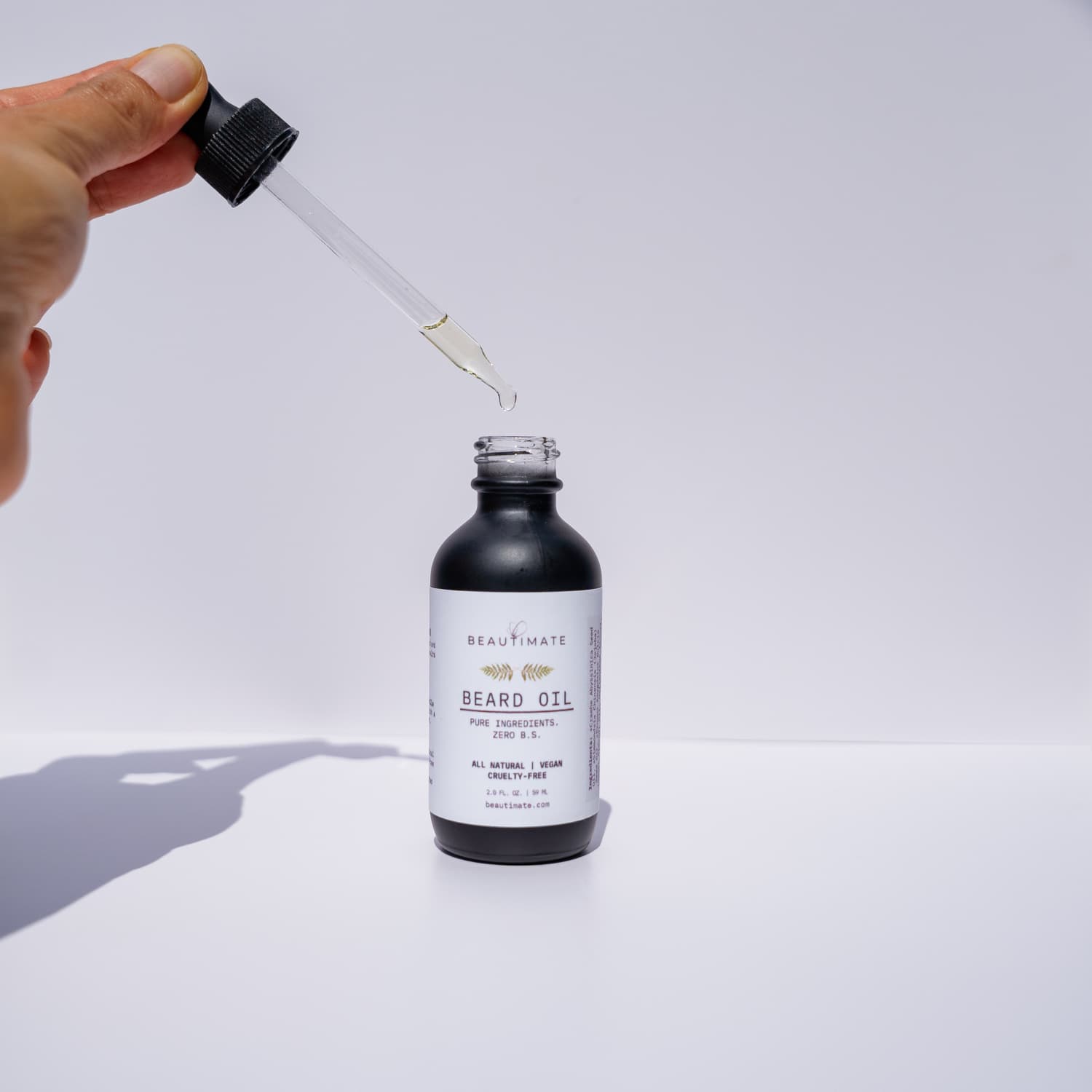 beard oil and the dropper showing consistency 