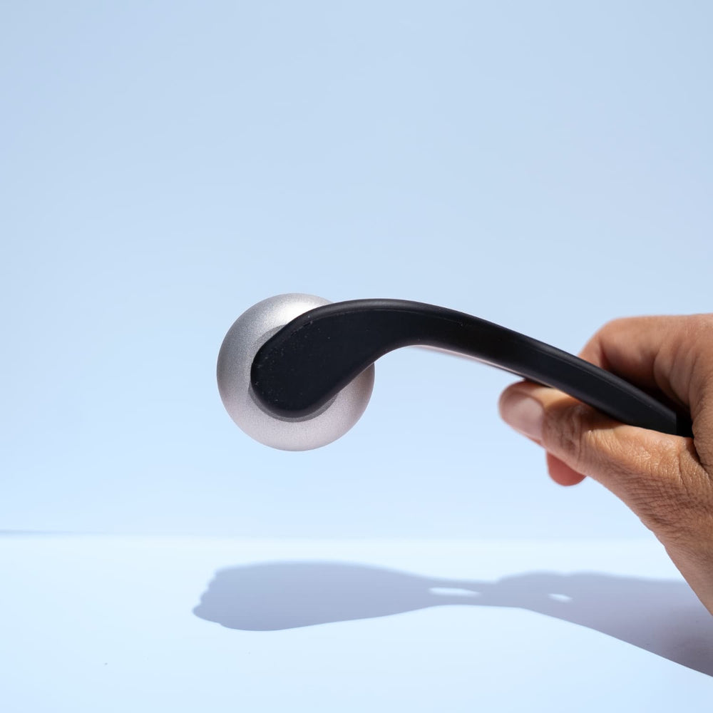 Beautimate Metal Ice Roller with solid aluminum roller head and black handle.