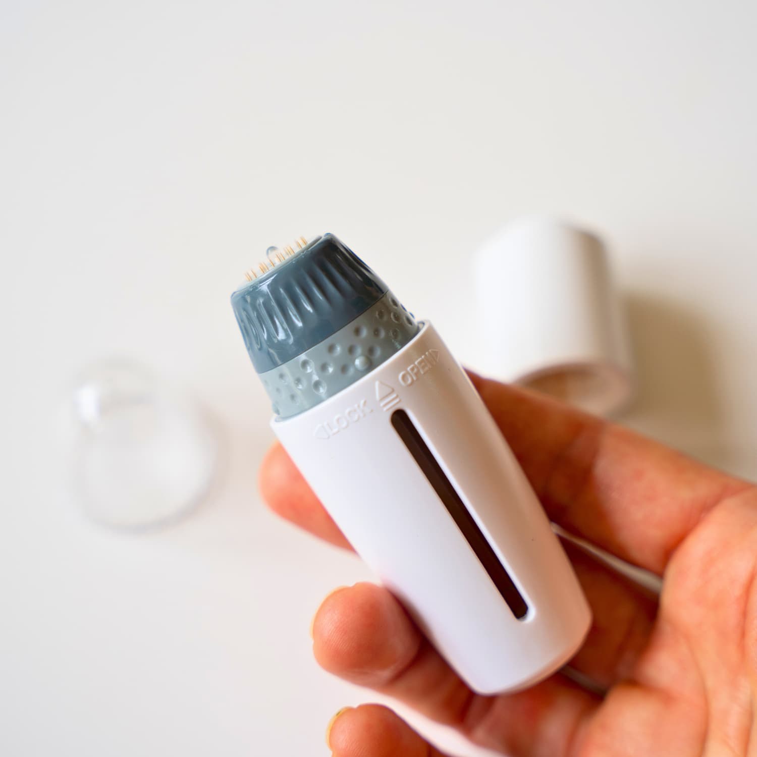Close-up view of 24 ultra-fine medical-grade stainless steel needles for microneedling face and scalp
