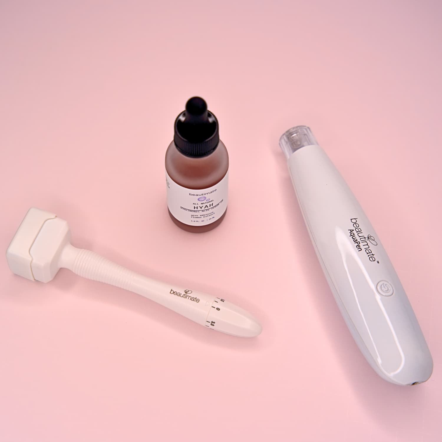 Beautimate Aqua Hydra Pen device on vanity with hyaluronic acid serum and derma stamp