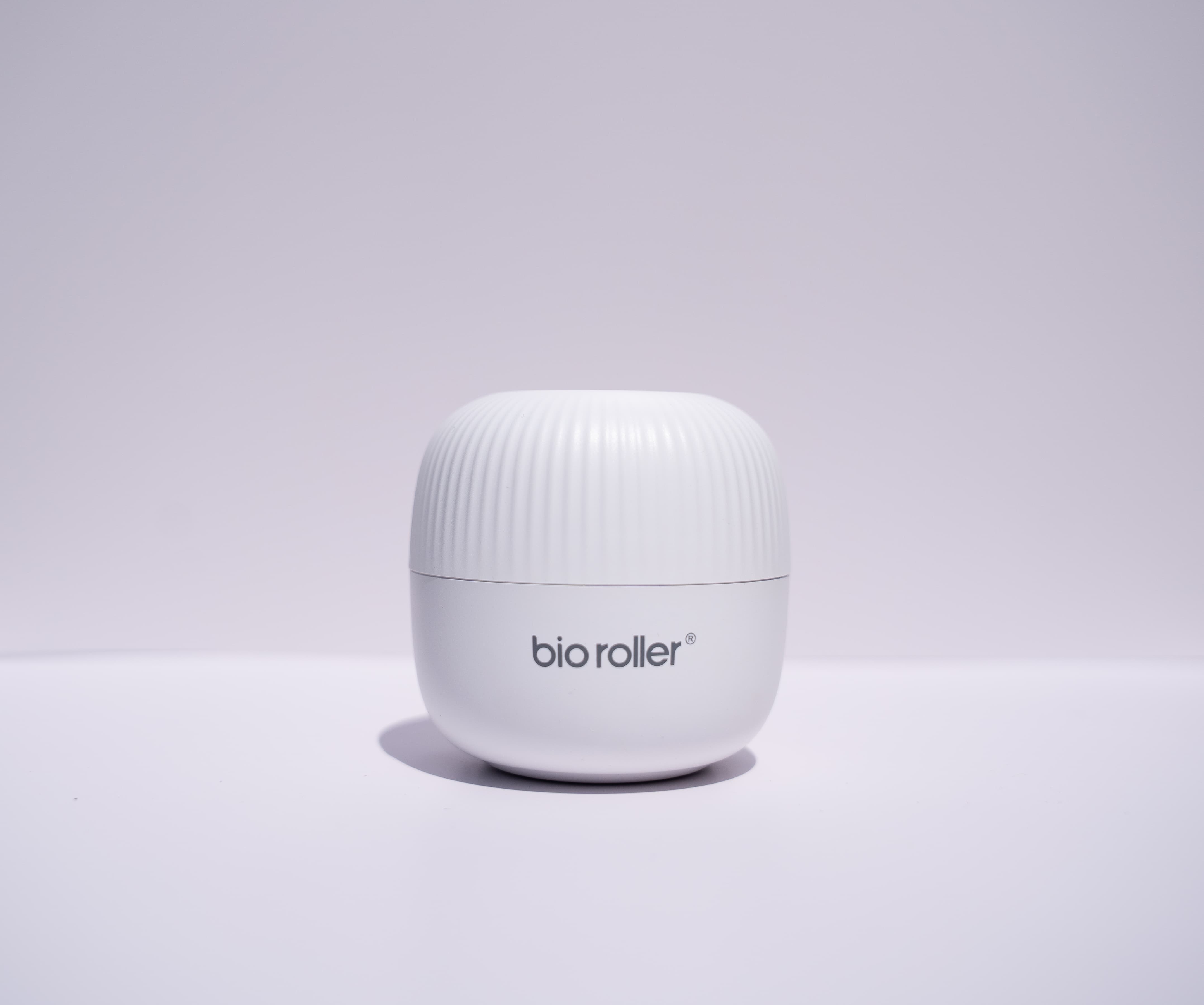 Applying 0.5 mm microneedle roller to stimulate collagen on body and scalp