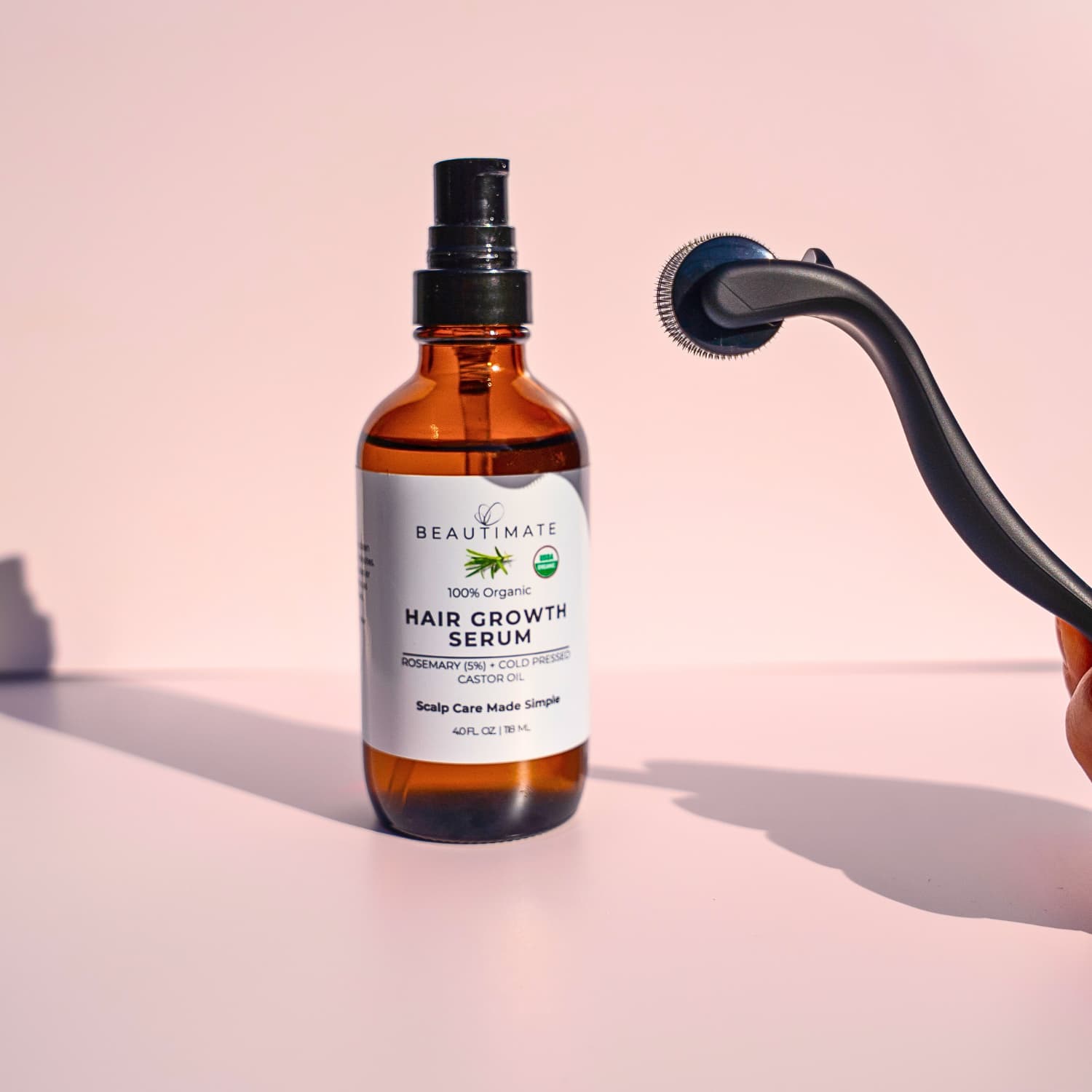 Beautimate at-home scalp care bundle featuring a microneedle derma roller and organic rosemary oil.