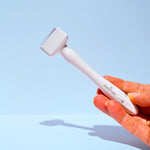 Hand holding Beautimate Adjustable Derma Stamp with 140 pins and 0.25mm–3.0mm depth dial