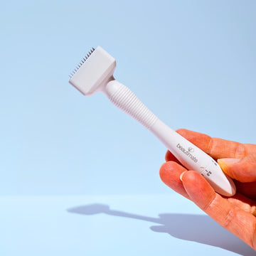 Hand holding beautimate adjustable derma stamp beauty tool for hair growth and healthy glowing skin