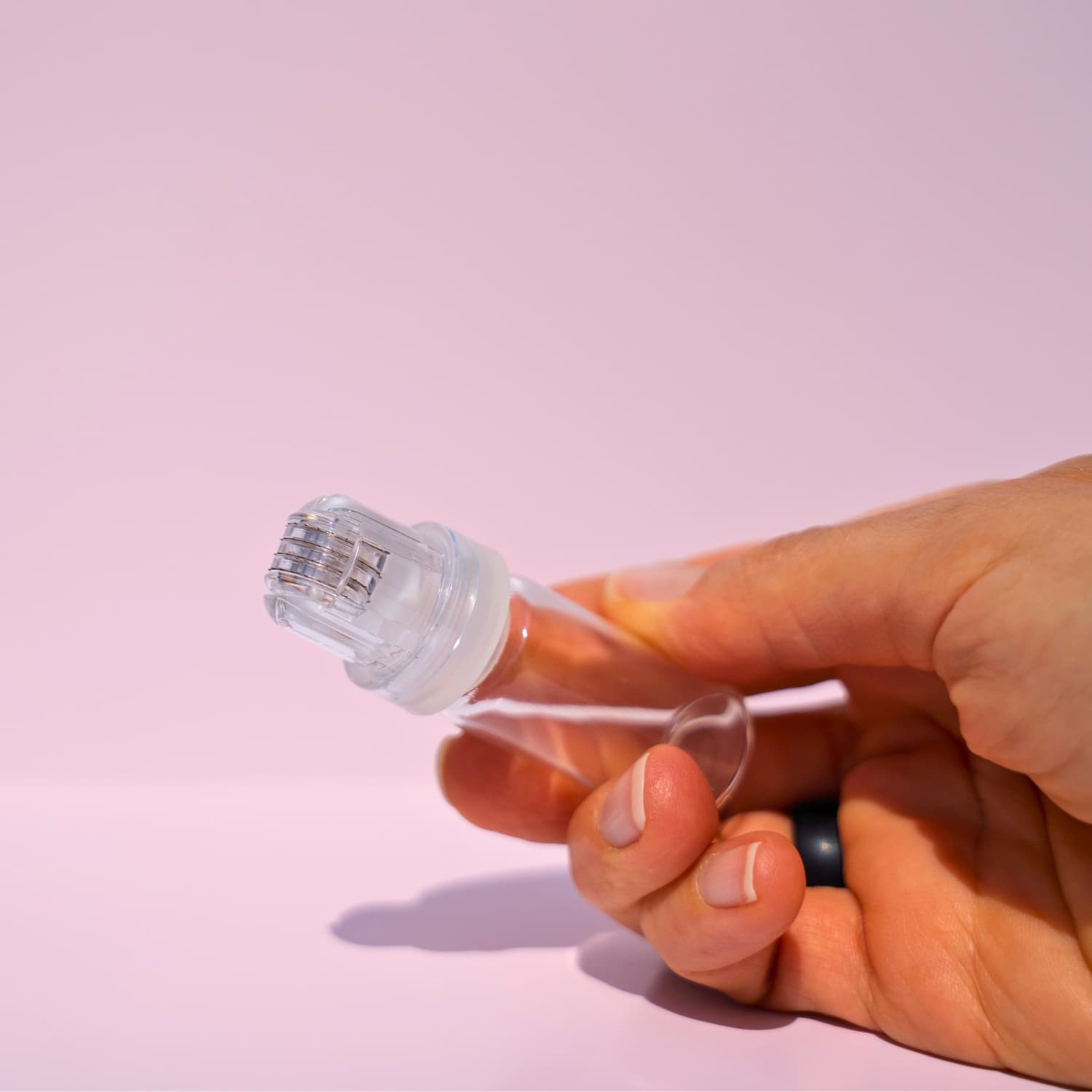 Compact and ergonomic Hydra Roller held in hand for size reference