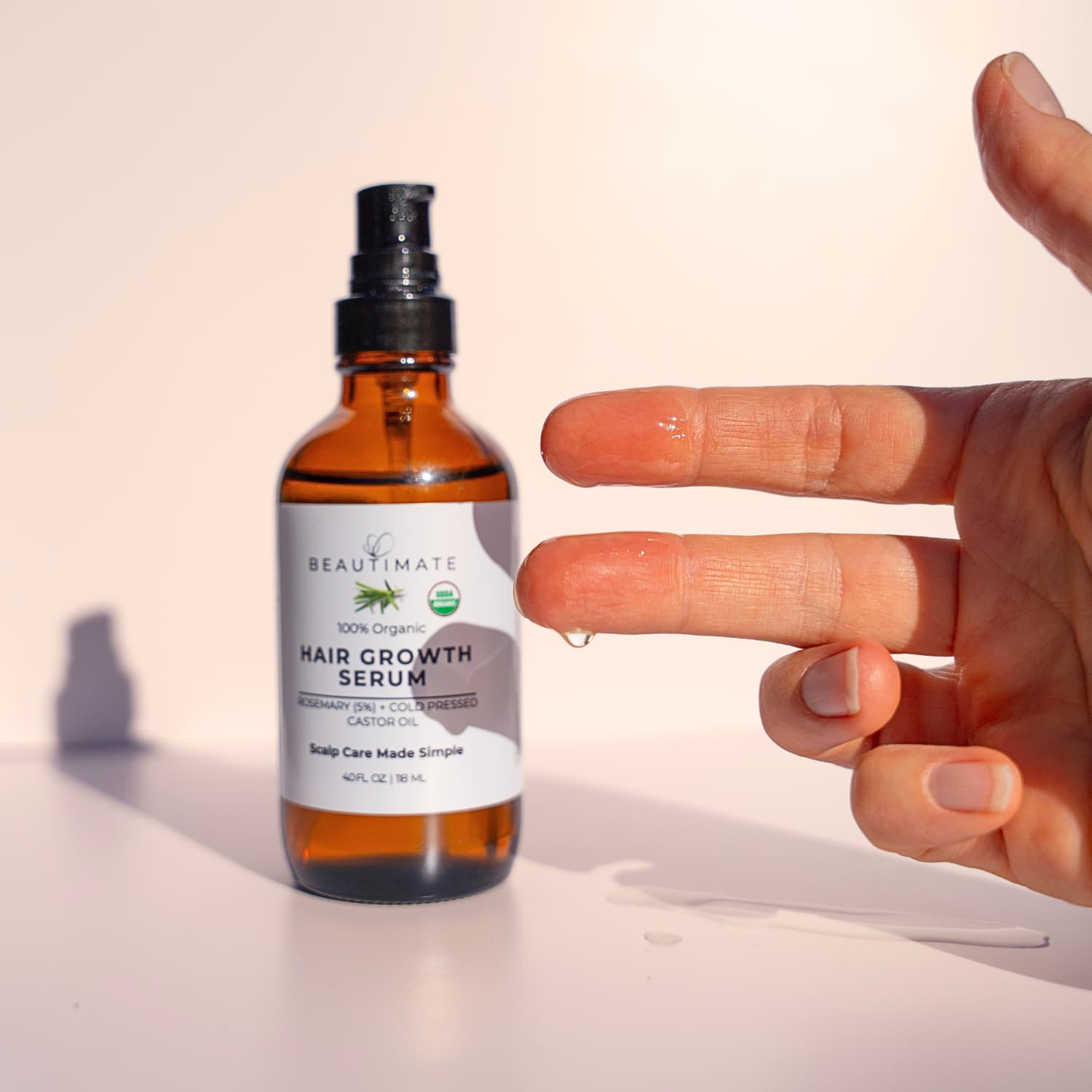 Natural hair growth oil made with organic rosemary and castor oil