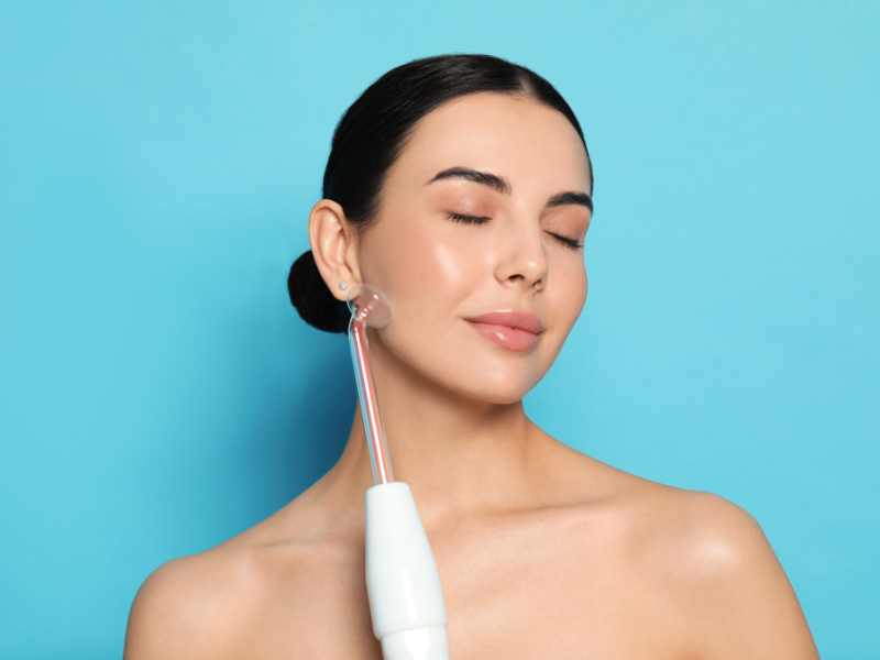woman using high frequency wand