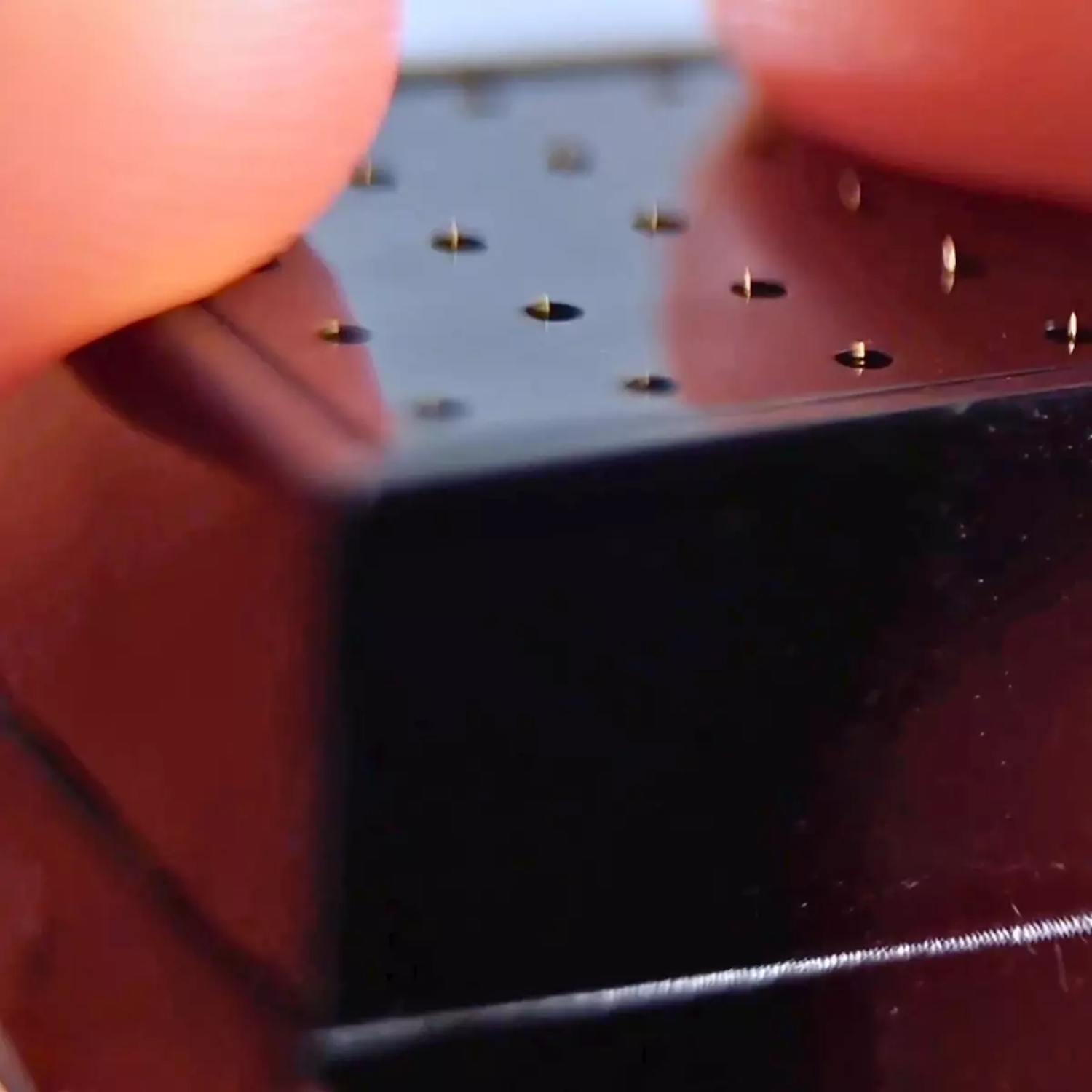 Close-up of 20 titanium microneedles on the Beautimate Hydra Stamp for precise serum infusion

