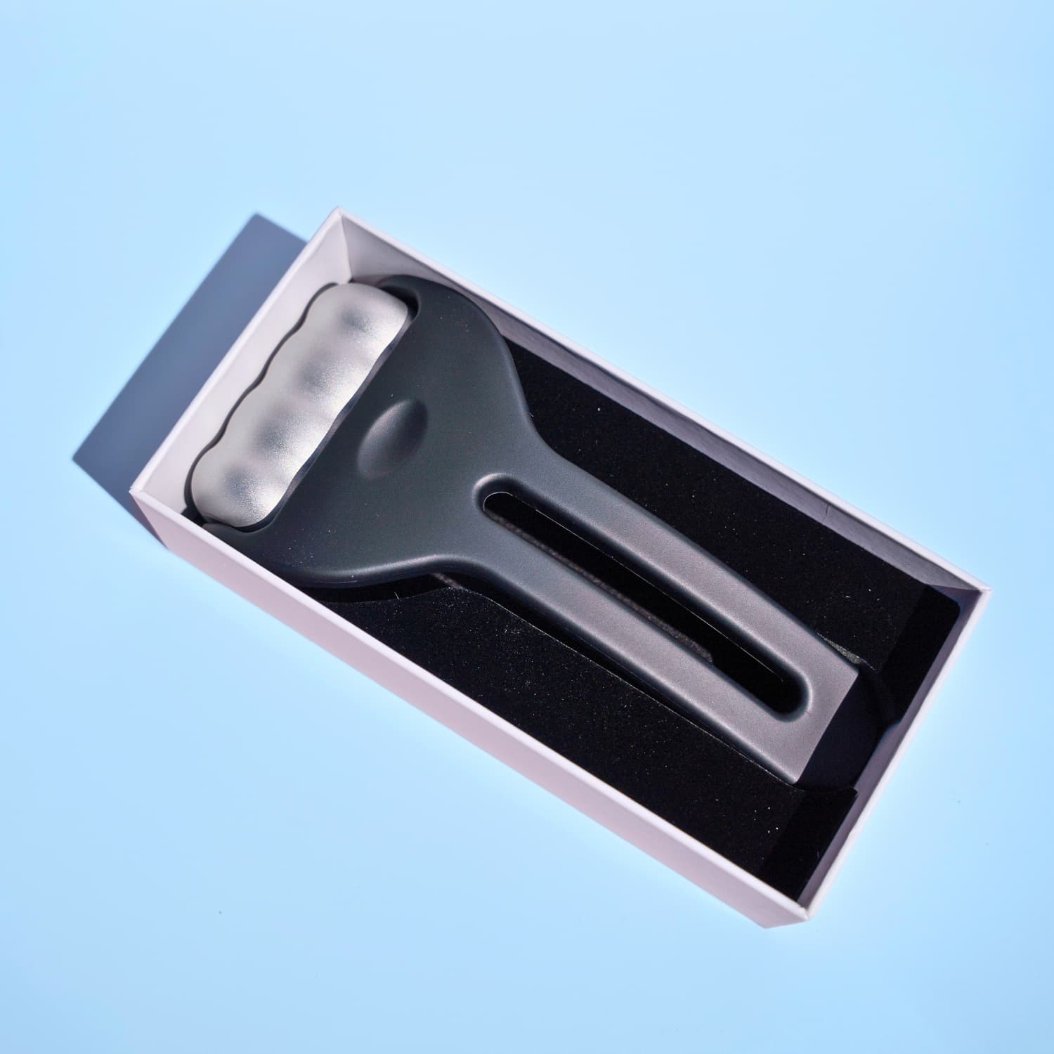 Beautimate Ice Roller with branded packaging shown in flat lay
