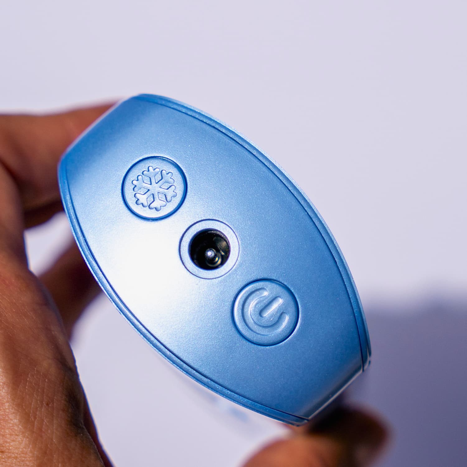 plug, cooling button and on button detail sof Beautimate Ice Cooling IPL hair removal tool