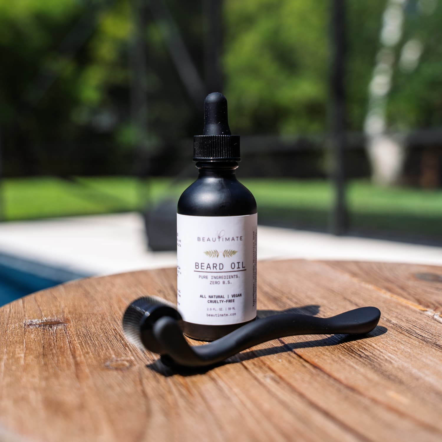 Natural beard oil in glass bottle on wooden surface