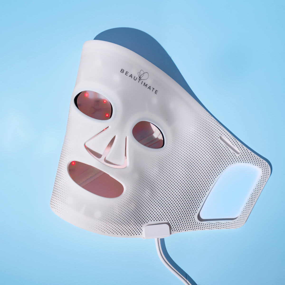 Beautimate LED light therapy face mask with red light emitting, shown on a light blue background.