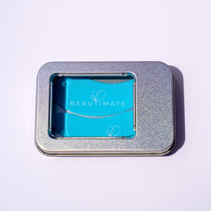 Reusable silicone eye patches stored inside the included metal tin.