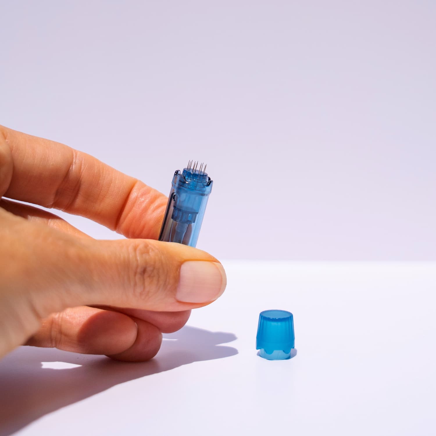 hand holding a replacement cartridge 