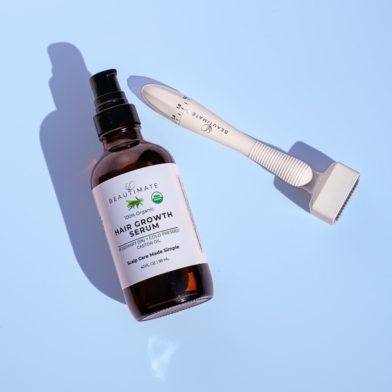 Hair growth serum bundle with derma stamp applicator on a light blue background