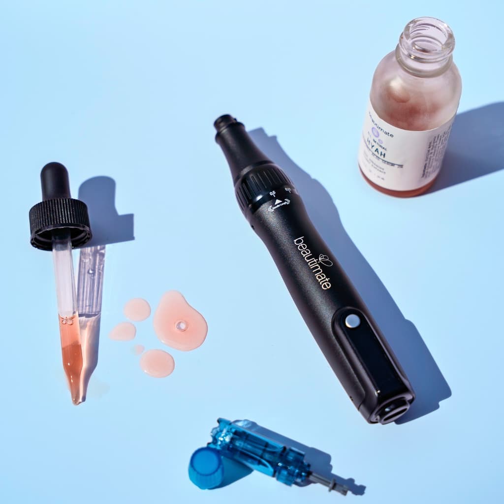 Beauty tools by beautimate: microneedle pen, hyah serum and cartridges, on a blue background 