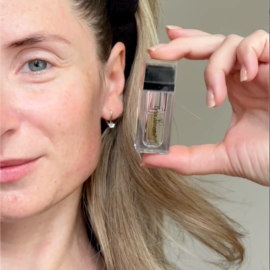woman holding beautimate hydra stamp