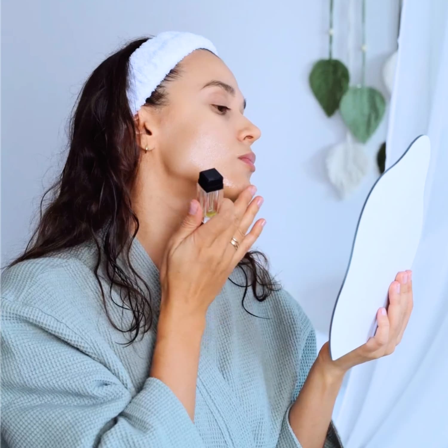 Using the Beautimate Hydra Stamp on cheek area for smoother skin and improved absorption
