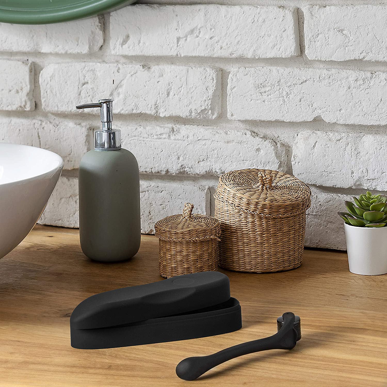 derma roller and travel care by bathroom sink