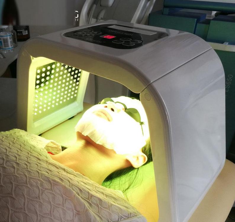 woman receiving treatment with yellow light